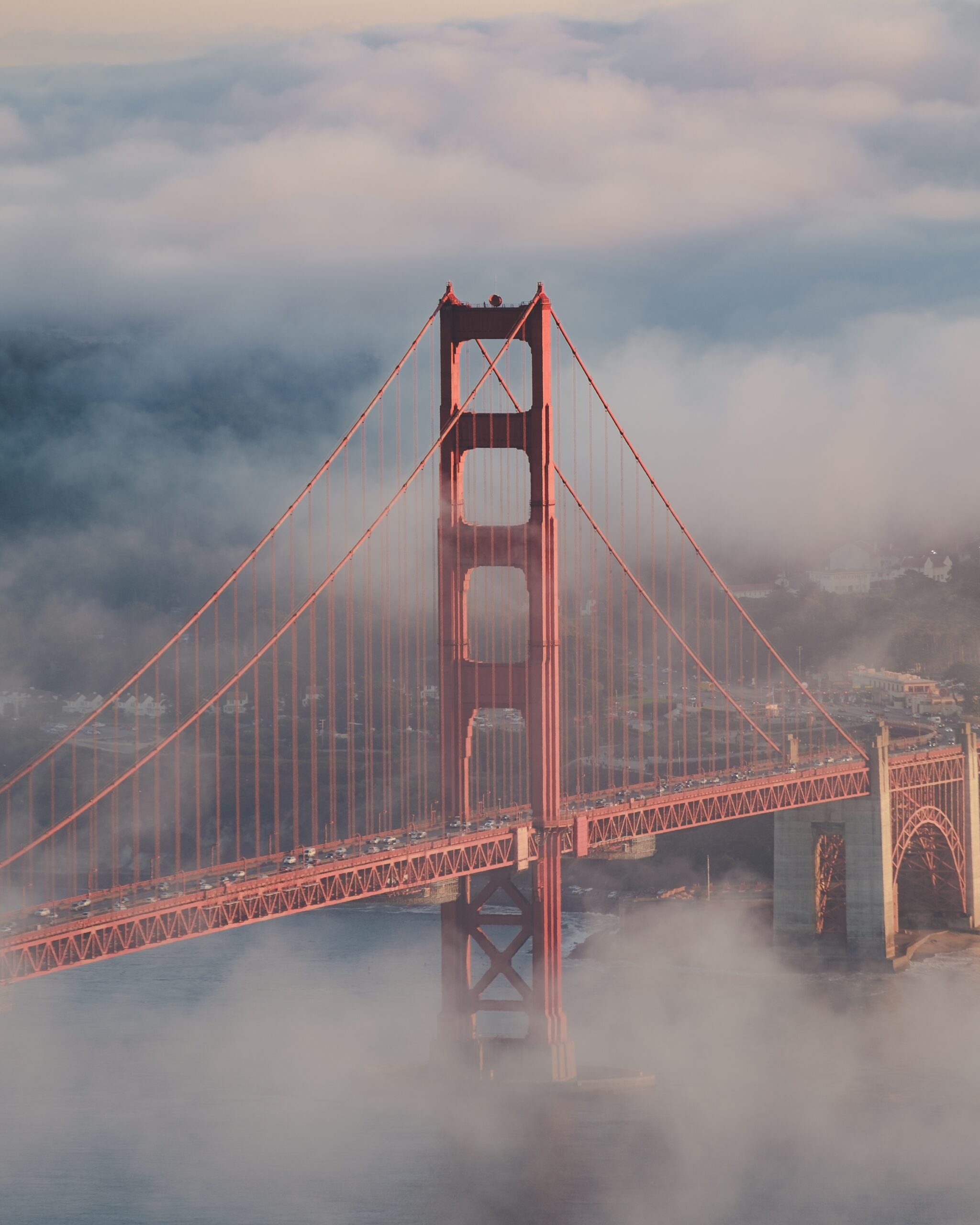 Vertical shot of the golden gate bridge surrounded by mist and clouds Ornare auctor - Image 1